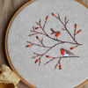 Hand embroidery with birds and berries