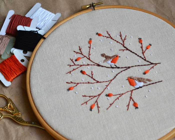 Hand embroidery with birds and berries