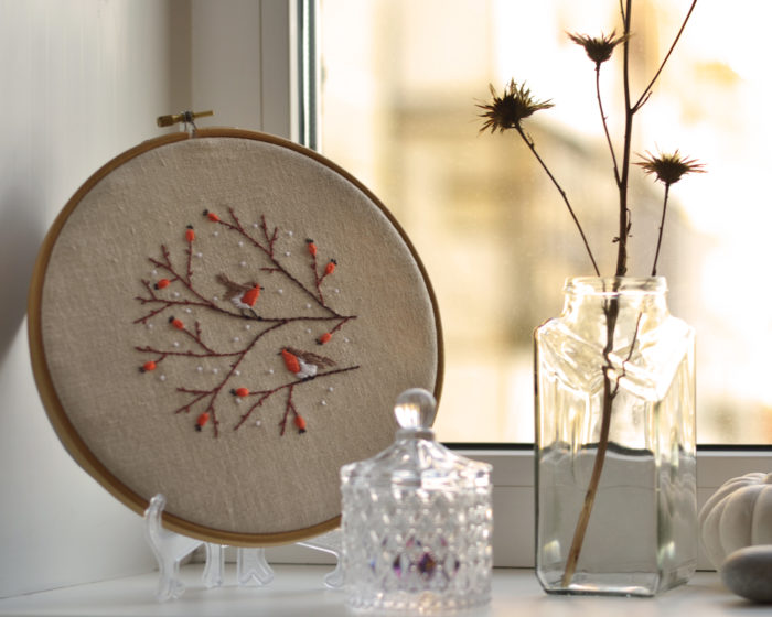 Hand embroidery with birds and berries