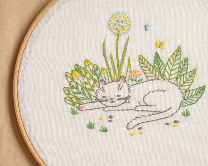 Cat in garden flowers hand embroidery hoop