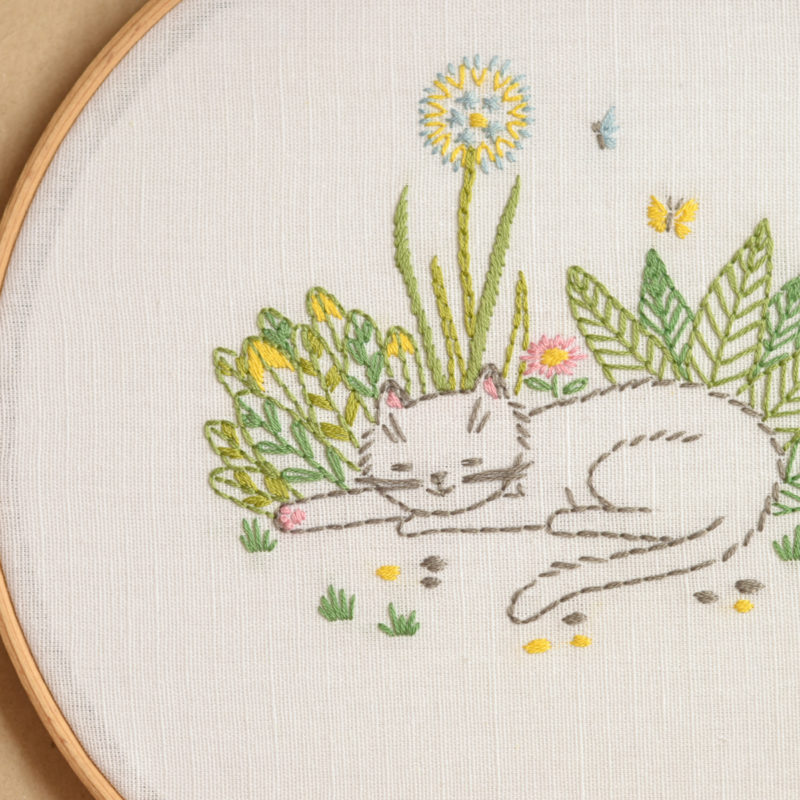 Cat in garden flowers hand embroidery hoop