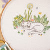 Cat in garden flowers hand embroidery hoop