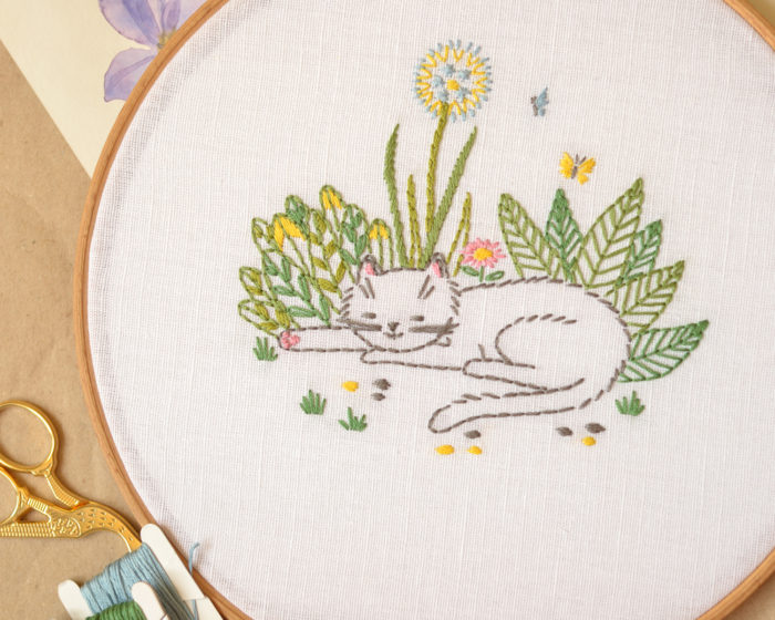 Cat in garden flowers hand embroidery hoop