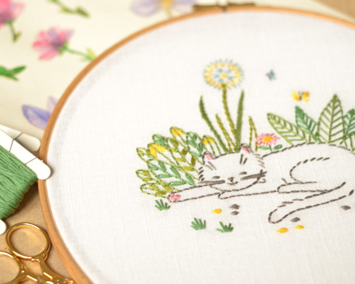 Cat in garden flowers hand embroidery hoop