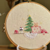 Cat under the Christmas tree hand embroidery hoop